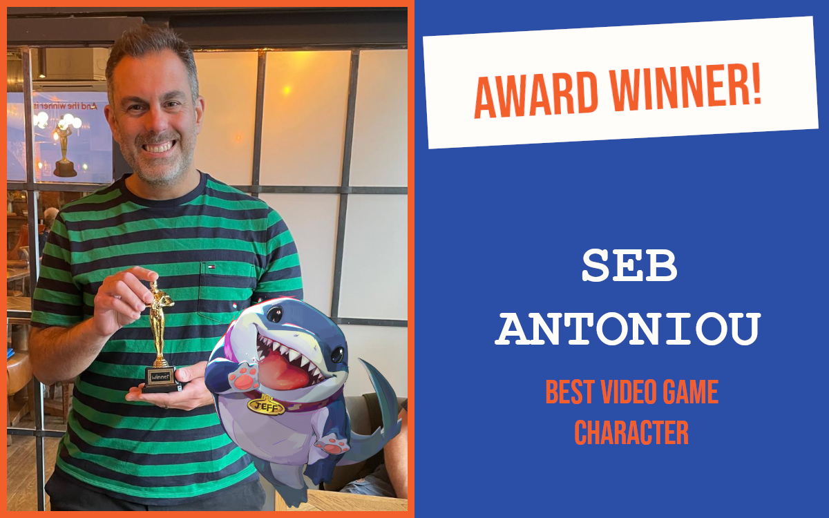 The June networking winner at the Cambridge event, holding the trophy, with his answer of Jeff the Shark added to the image.