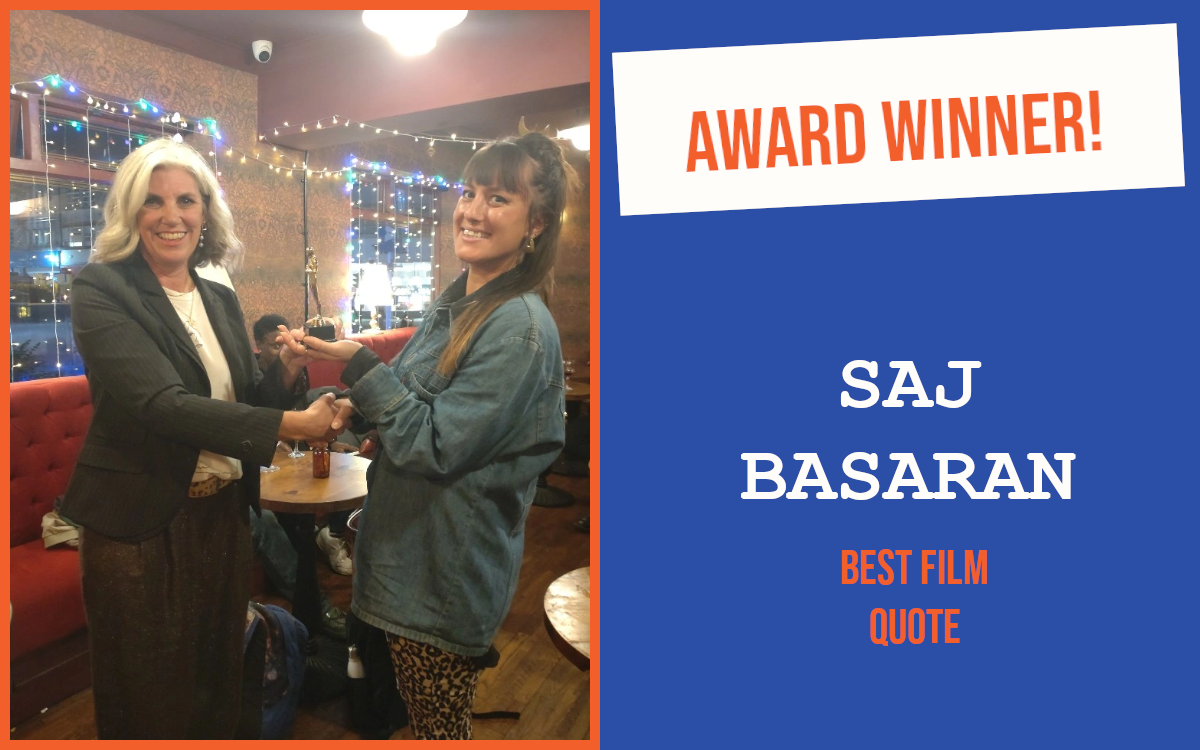 The winner of the networking question at Brighton's September event holding the trophy, pictured with the host.