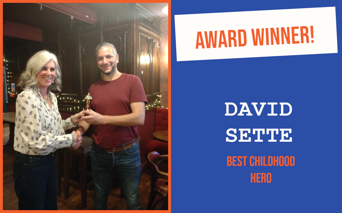 Brighton's October networking meeting winner holding the trophy.