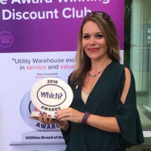 Justine Goddard, ambassador of the Cambridge PubNetworking event, holding a trophy for the 2018 Which? awards.