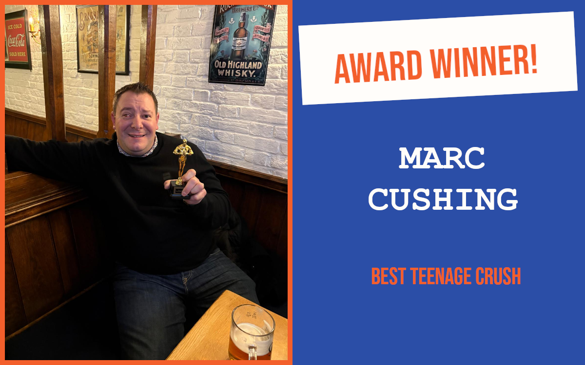The winner of the January Norwich networking meeting's question, holding the trophy.