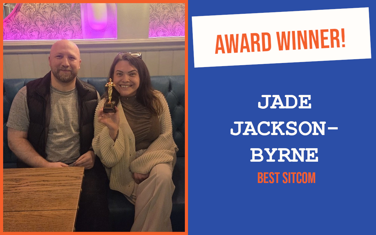The winner of the networking question at the March meeting of the South East Essex networking event, holding the trophy and sitting with the host.